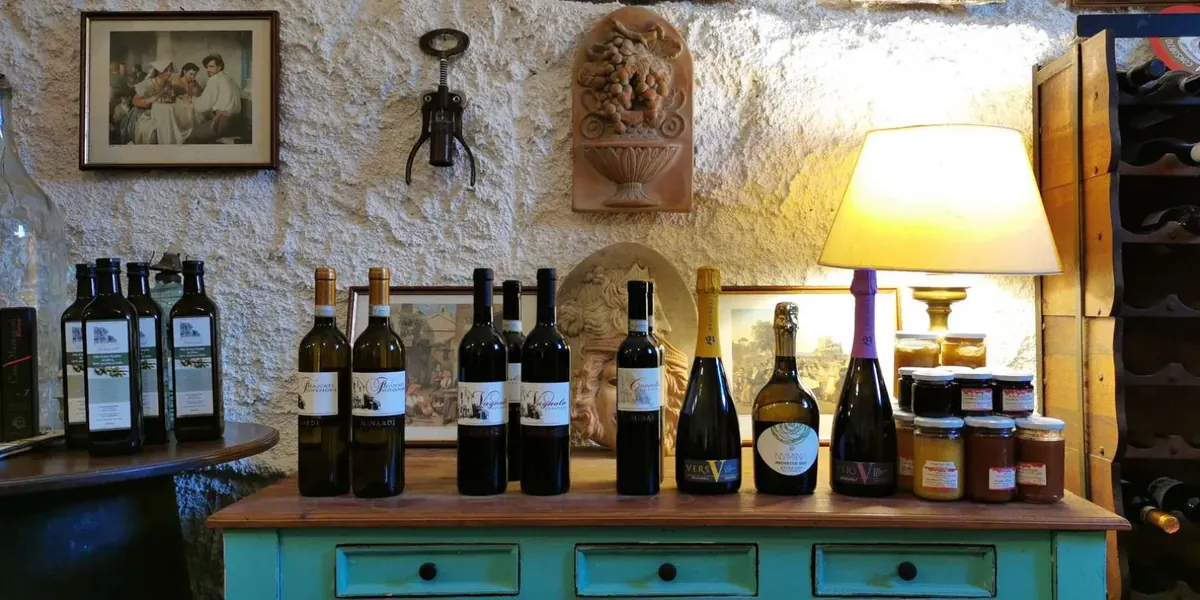 Wine bottles displayed in the historic farmhouse cellar