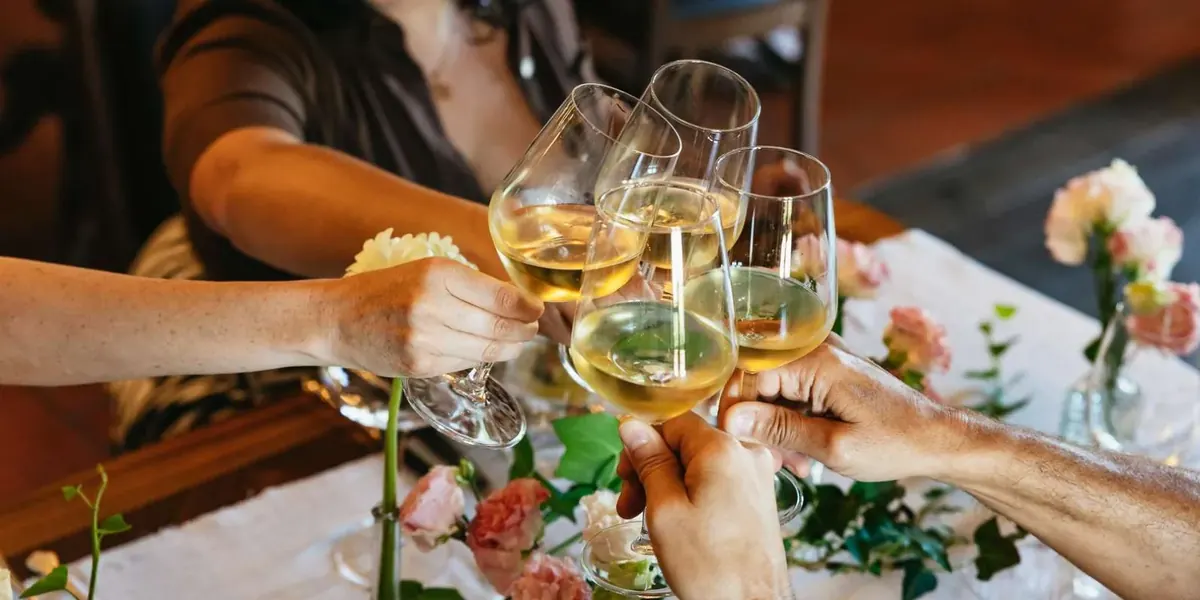 Glasses raised during a wine-and-food tasting